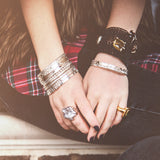 Model wears the Magic carpet Bracelet along with several Sterling Silver bangles, a gold and Emerald ring and a Sterling Silver and large freshwater pearl ring.