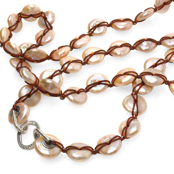 Close up of RANGER Freshwater pearl  necklace with the leather cord detail and C lock in Sterling Silver showing.