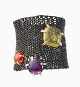 Magic carpet leather bracelet with fused glass set in Silver and gold prong mountings.