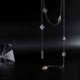 Time Capsule lariat necklace in oxidized silver with ancient roman coin, gemstones and an authentic arrowhead by Carolina Cole.