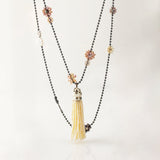 the snowdrift freshwater pearl tassel charm hangs from the bunches oxidized sterling silver necklace