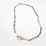 rectangular sterling silver links that are textured and of different lengths form the Chelsea Necklace