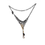 Distressed oxidized silver and 18K yellow gold chain maille necklace with a black and a white freshwater pearl.