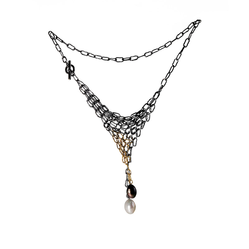 Distressed oxidized silver and 18K yellow gold chain maille necklace with a black and a white freshwater pearl.