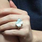 model wears a Blanch pearl ring with a white pearl