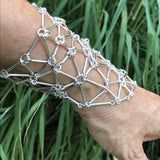 Gleaming stick links forming a sterling silver glove/bracelet