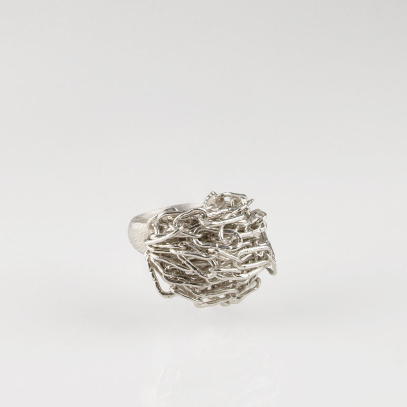 Sterling silver chain maille ring by Carolina Cole shown from the side