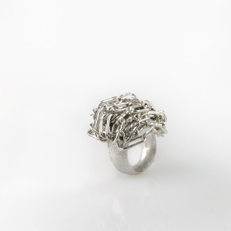 Sterling silver ring with a nest of fine silver chain on top by Carolina Cole
