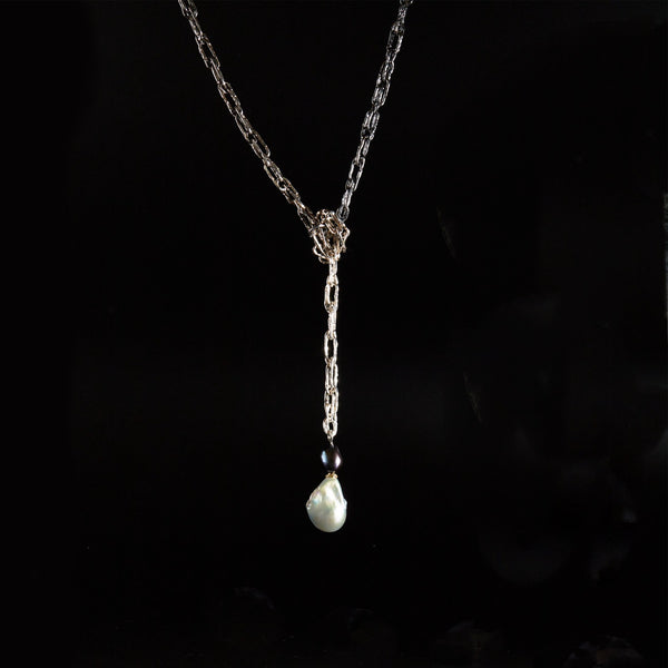 Dark Side Necklace in ombre Sterling Silver and black and white freshwater pearls, knotted by Carolina Cole